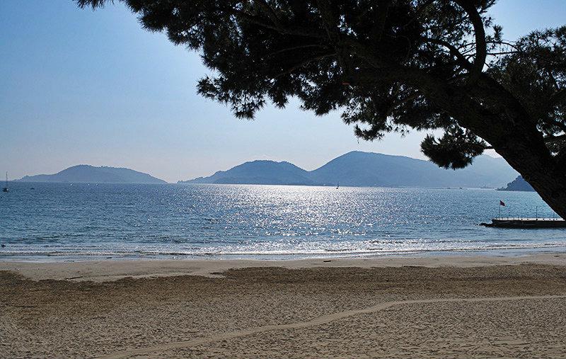 Sandy beach and clear blue sea in Lerici